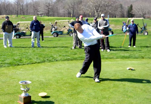 Eddie Neer hits the first tee shot of the 2011 season in the Greater Cleveland Skins Game