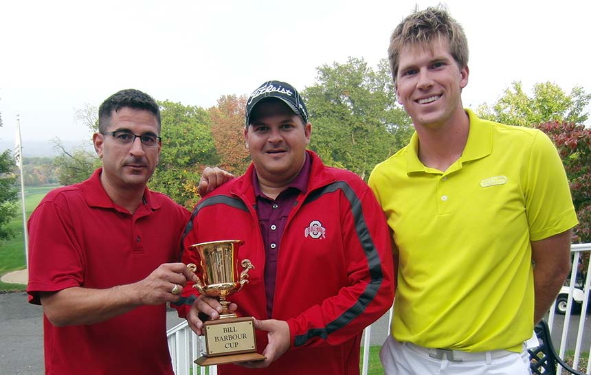 Niko Anagnost (left) and Dave Sotka take the Bill Barbour Cup, presented by grandson Billy Barbour