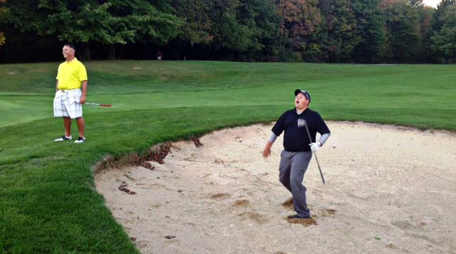 Dave Sotka of Chardon reacts to his near miss bunker shot for eagle on the last hole of the season at Powderhorn while Champion Steve Blackburn Jr. looks on with delight. The picture sums up Blackburne Jr.'s championship and Sotka's runner up performance on the season.