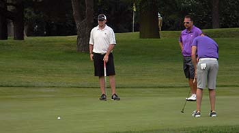 Lower sends his final putt in the 2014 Lazor