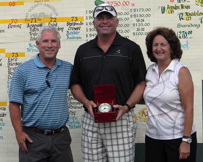 2014 Summit County Am Champion Howard Clendenin is flanked by Pat Wheeler and Mary Barnes.