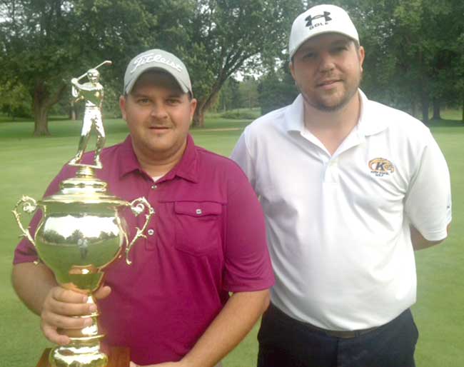 Dave Sotka hoists the 2014 Shoot-Out trophy after outlasting Phil Bojc in a playoff.