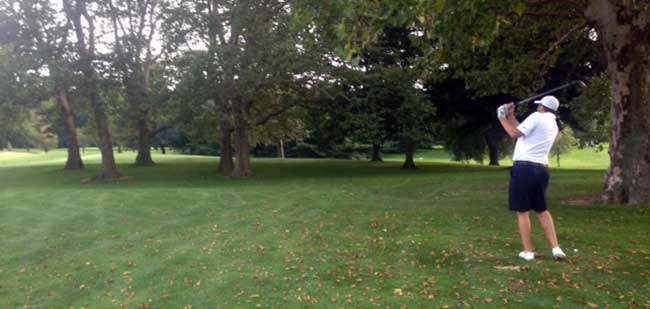 Phil Bojc plays his second shot from the right trees on the first playoff hole and finds the green.