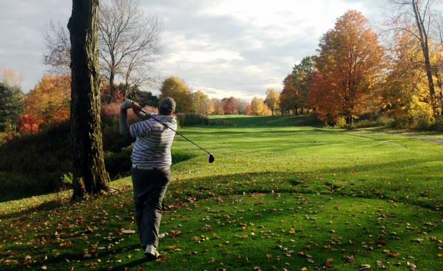 Dave Sotka tees off at the 14th hole at Fowler's Mill on the final evening of the 2014 season