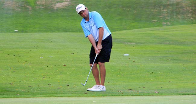 Rob Schustrich of Windham chips to the 18th green at Good Park on his way to a win at the 2015 Senior Summit County Amateur Golf Championship.