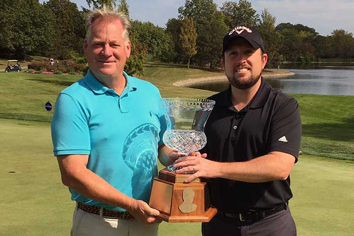 Tim Conley (l) wins the Senior Division of the Habitec Toledo Open in a playoff; Habitec President John Smythe (r) presents the trophy.