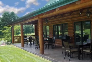 the log cabin clubhouse at The Fairways at Twin Lakes