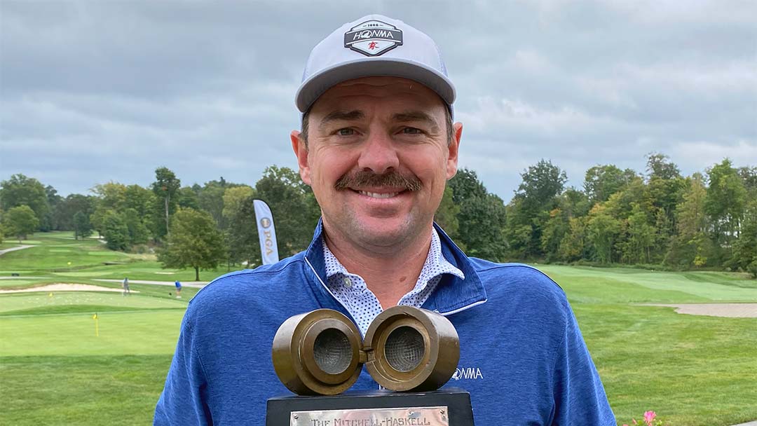 Jim Troy with the 2021 Mitchell-Haskell trophy