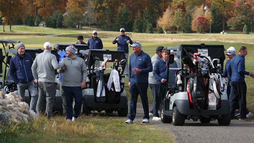 Players watch the action at the 2022 Lewis Cup